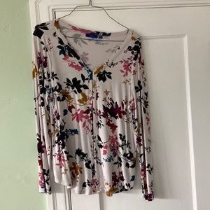 Ladies top w/ multiple fall color leaves on white background